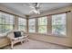 Bright sun room with multiple windows, neutral walls, and a comfortable sitting area at 8545 Hopkins Circle # G, Myrtle Beach, SC 29575