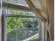 Window view overlooking lush greenery and serene pond at 8545 Hopkins Circle # G, Myrtle Beach, SC 29575