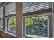 View of a window overlooking a calm pond at 8545 Hopkins Circle # G, Myrtle Beach, SC 29575