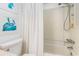 Bright bathroom showing shower and toilet with nautical decor at 88 Salt Marsh Circle # 22C, Pawleys Island, SC 29585