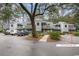 Inviting townhomes feature outdoor balconies and shared parking in a well-maintained, wooded community at 88 Salt Marsh Circle # 22C, Pawleys Island, SC 29585