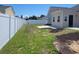 Wide open backyard featuring a green lawn, white fence, and patio at 920 Leather Leaf Ln., Longs, SC 29568