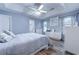 Primary bedroom with wood floors, tray ceiling, and ensuite bathroom at 920 Leather Leaf Ln., Longs, SC 29568