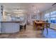 Open dining area featuring natural light and a view into the modern kitchen at 920 Leather Leaf Ln., Longs, SC 29568