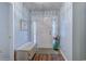 Bright entryway with a decorative bench, vase, and a view of the front door at 920 Leather Leaf Ln., Longs, SC 29568