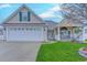 Charming single-story home featuring a two-car garage, well-maintained lawn, and inviting porch at 920 Leather Leaf Ln., Longs, SC 29568