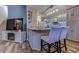 Well-lit kitchen featuring a breakfast bar with granite countertops and stainless steel appliances at 920 Leather Leaf Ln., Longs, SC 29568