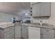 Eat-in kitchen island boasts granite countertops with a view of the living area and backyard at 920 Leather Leaf Ln., Longs, SC 29568