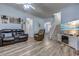 Open-concept living room with a cozy seating area, a fireplace, and a staircase at 920 Leather Leaf Ln., Longs, SC 29568