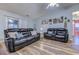 Spacious living room with comfortable seating and slider doors at 920 Leather Leaf Ln., Longs, SC 29568
