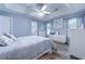 Comfortable primary bedroom with tray ceilings, a ceiling fan, and a bathroom ensuite at 920 Leather Leaf Ln., Longs, SC 29568