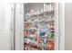 Walk-in pantry with wire shelving fully stocked with food and household items at 920 Leather Leaf Ln., Longs, SC 29568