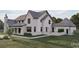 Angle view of a beautiful home, showcasing a pristine lawn, covered patio, and modern exterior features at 9413 Park St., Myrtle Beach, SC 29572