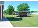 Large backyard featuring a shed and shelter, offering ample space and utility at 960 South Farr Ave., Andrews, SC 29510