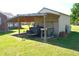 Backyard with a large shelter that has a trailer at 960 South Farr Ave., Andrews, SC 29510