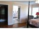 En suite bedroom showcasing an attached bath with marble floors and white cabinetry at 960 South Farr Ave., Andrews, SC 29510