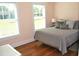 A cozy bedroom with wood floors featuring large windows at 960 South Farr Ave., Andrews, SC 29510