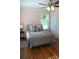 A cozy bedroom featuring a ceiling fan and wood floors at 960 South Farr Ave., Andrews, SC 29510