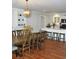 Dining area showcasing a wooden table, elegant seating, and a view of the kitchen and island at 960 South Farr Ave., Andrews, SC 29510