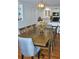 Spacious dining area with a large wooden table perfect for entertaining and a view of the kitchen at 960 South Farr Ave., Andrews, SC 29510