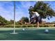 Close up shot of a golfer putting on a green with trees in the background at 101 Ocean Creek Dr. # Jj-1, Myrtle Beach, SC 29572