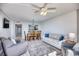 Living room with open floor plan into dining room and views into the kitchen and living spaces at 101 Ocean Creek Dr. # Jj-1, Myrtle Beach, SC 29572