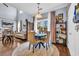 Cozy dining area featuring elegant furnishings, a large window with natural light, and seamless flow to other living spaces at 1040 Fairway Ln. # 1040, Conway, SC 29526