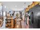 Open kitchen featuring wooden cabinetry, black appliances, and a seamless connection to the dining area at 1040 Fairway Ln. # 1040, Conway, SC 29526