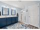 Bright bathroom showcasing double sinks, modern vanity with a walk-in shower with glass doors at 1109 Donald St., Conway, SC 29527