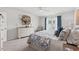 Well-lit bedroom features a comfortable bed, soft carpet, a window with curtains and a decorative dresser at 1109 Donald St., Conway, SC 29527