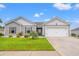 Charming single-story home with well-manicured lawn, gray siding and a two car garage at 1109 Donald St., Conway, SC 29527