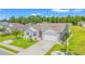 Aerial view of a home featuring an attached garage, well-kept lawn, and complemented by vibrant landscaping at 1109 Donald St., Conway, SC 29527