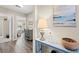 Bright hallway with stylish decor, wooden floors, and a glimpse into a well-lit bedroom at 1109 Donald St., Conway, SC 29527