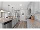 Modern kitchen with stainless steel appliances, granite countertops and a large central island at 1109 Donald St., Conway, SC 29527