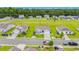 Aerial shot showcases a Gathering-friendly neighborhood with well-maintained homes, green spaces and a tranquil pond at 1109 Donald St., Conway, SC 29527