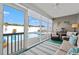 Relaxing screened-in porch with comfortable seating overlooks the sparkling swimming pool at 1109 Donald St., Conway, SC 29527