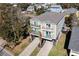 A captivating aerial view showcasing this raised beach home with its expansive property and neighborhood at 124 B Vista Dr., Murrells Inlet, SC 29576