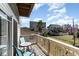 Relaxing balcony view with a table and chairs overlooking a quaint beach neighborhood on a sunny day at 124 B Vista Dr., Murrells Inlet, SC 29576