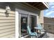 Cozy deck space with two chairs, a table, and sliding glass door perfect for outdoor relaxation at 124 B Vista Dr., Murrells Inlet, SC 29576