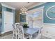 Inviting dining area with a large window, stylish table setting, and elegant lighting at 124 B Vista Dr., Murrells Inlet, SC 29576