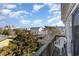 Relaxing view of the neighborhood from the deck, with lush trees and residential buildings at 124 B Vista Dr., Murrells Inlet, SC 29576