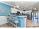 Contemporary kitchen featuring white cabinetry, blue accents, and stainless steel appliances at 124 B Vista Dr., Murrells Inlet, SC 29576