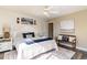 Bright main bedroom featuring coastal decor, wood-style flooring and ensuite access at 124 B Vista Dr., Murrells Inlet, SC 29576