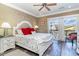 Comfortable main bedroom featuring a decorative headboard, balcony access, and calming neutral tones at 124 B Vista Dr., Murrells Inlet, SC 29576