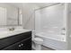 Bathroom featuring a black vanity, white toilet, and shower-tub combination with a curtain rod at 125 South Shore Blvd. # 201, Longs, SC 29568