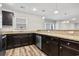 Kitchen showcasing granite countertops, dark wood cabinets, and stainless steel dishwasher at 125 South Shore Blvd. # 201, Longs, SC 29568