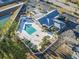 Aerial view of community pool and clubhouse, surrounded by landscaping and ample parking spaces at 125 South Shore Blvd. # 201, Longs, SC 29568