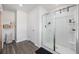 Beautiful bathroom features wood look flooring, glass enclosed shower, and functional shelving at 128 Caveson Way, Conway, SC 29526