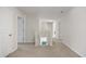 Upstairs hallway with three doors leading to separate rooms and stairs to the lower level at 128 Caveson Way, Conway, SC 29526