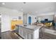 Kitchen island with granite countertops, a sink, white cabinets, and an open-concept layout at 128 Caveson Way, Conway, SC 29526